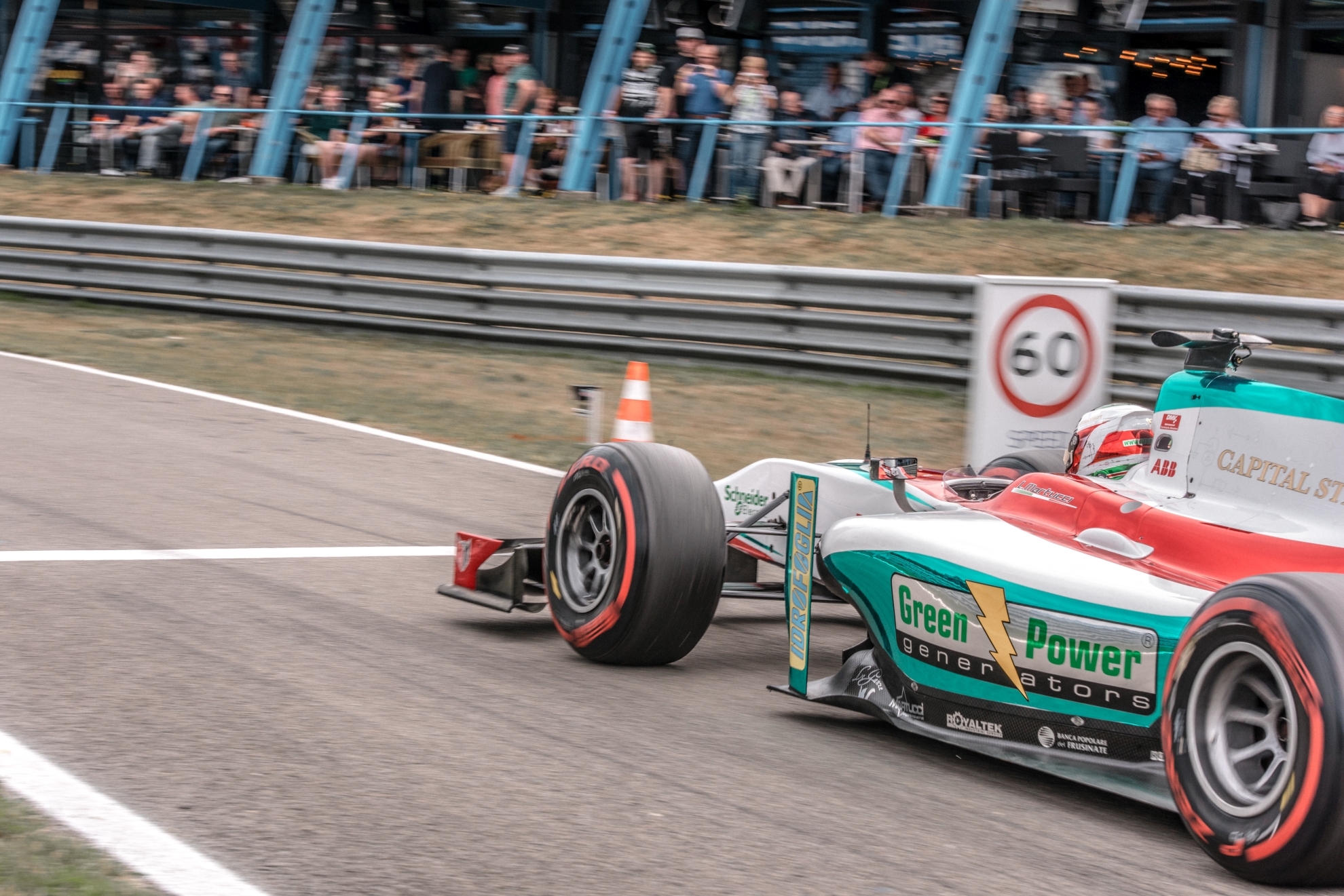 A GP2 car drives into the pit lane in Assen