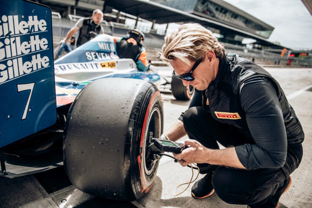 A Pirelli engineer checks the tyre pressure